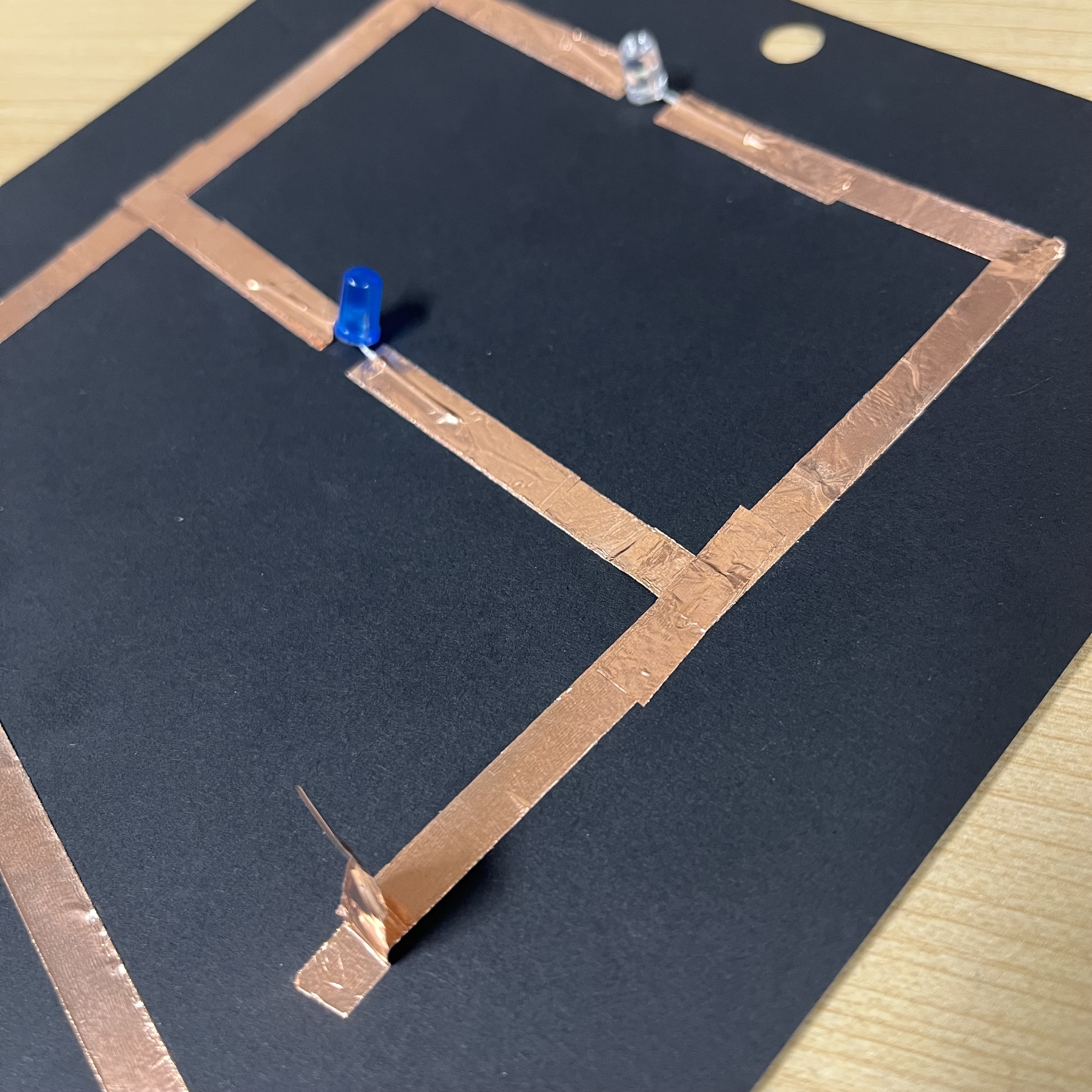 This is my first attempt at a parallel circuit. I had to be mindful of the folds to keep the circuit continuous, since this tape is only conductive on 1 side. This would be easier with tape that is conductive on both sides.