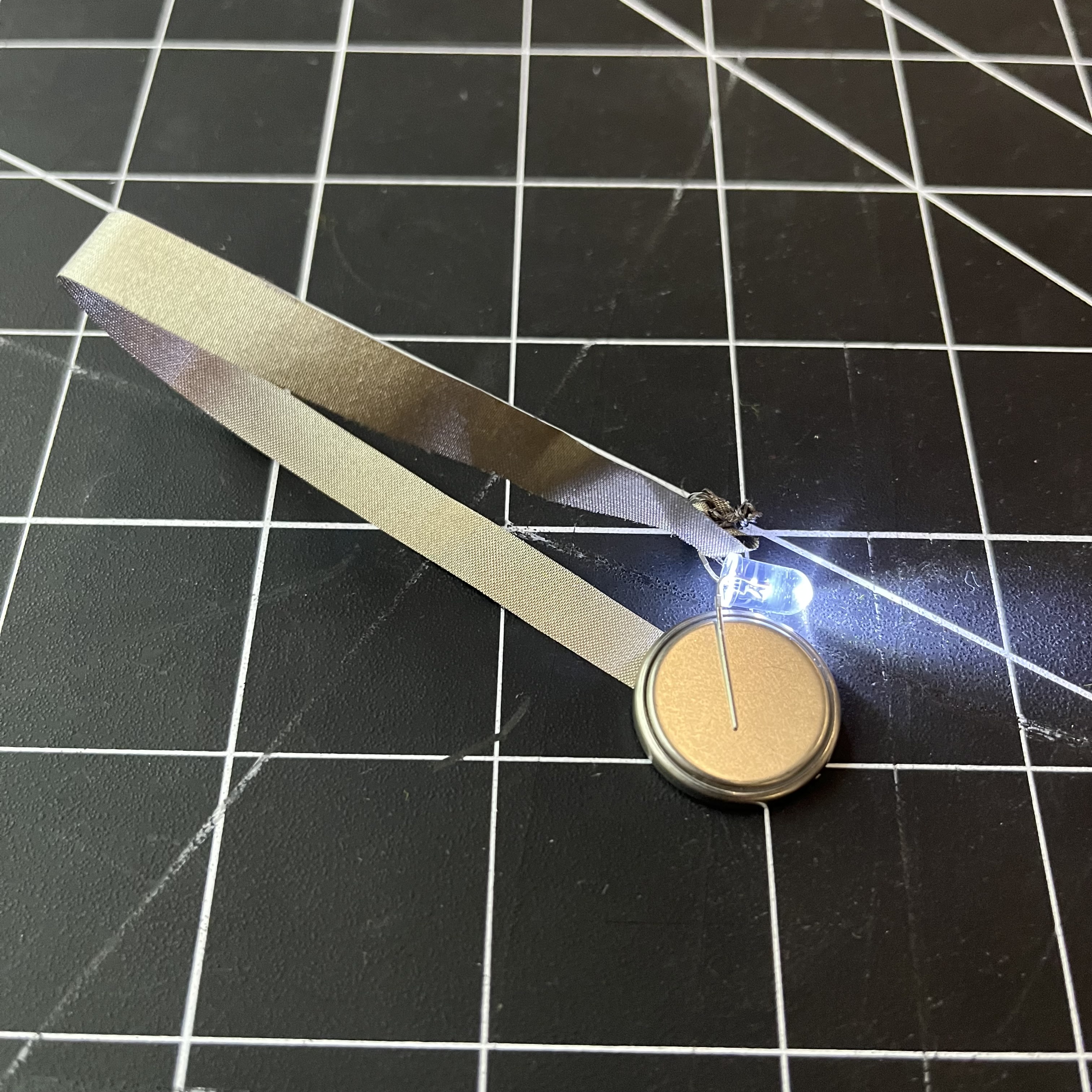 Here is the ribbon circuit closed, with 1 battery powering the single LED to show it is functional.